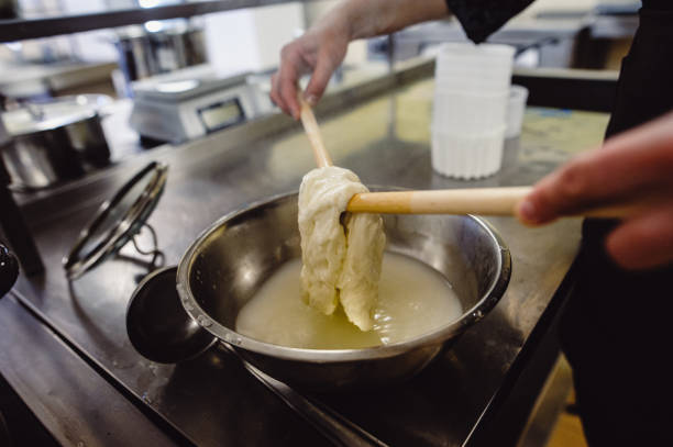 istock The home-made cheese maker produces handmade mozzarella with fresh quality milk. Concept: tradition, italy, mozzarella.The process of making mozzarella. 1227328367