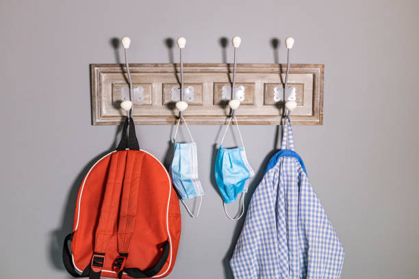 istock Coat rack of a school boy in a new normality 1227333290