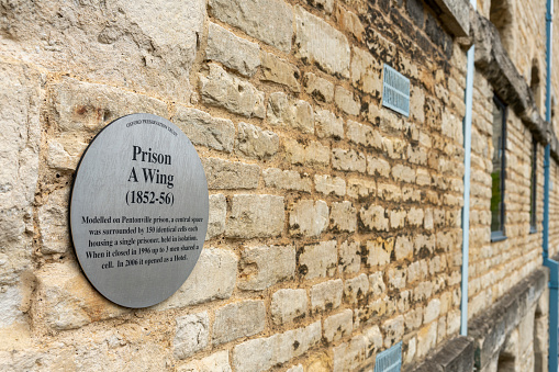 Plaque outside Oxford Gaol (Prison). The prison is on Castle Street, Oxford, Oxfordshire, England, UK.  The exterior is on publicly accessible land and no fee is required to view the exterior.