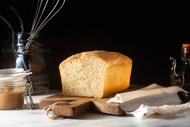 istock Fresh homemade Toast bread on the kitchen table, dark background. 1227336702