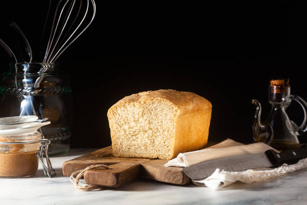 istock Fresh homemade Toast bread on the kitchen table, dark background. 1227336704