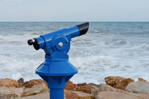 A close up of coin-operated beach binoculars.