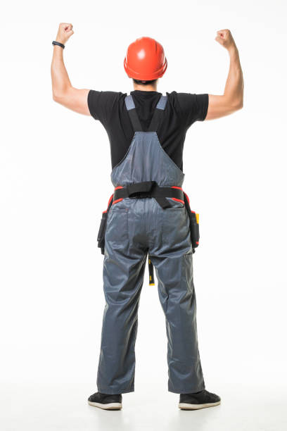 istock Rear view of thoughtful young worker looking up on white background 1227338687