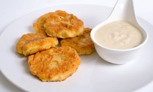 istock Pea cutlets on white table with tahini sauce 1227339620