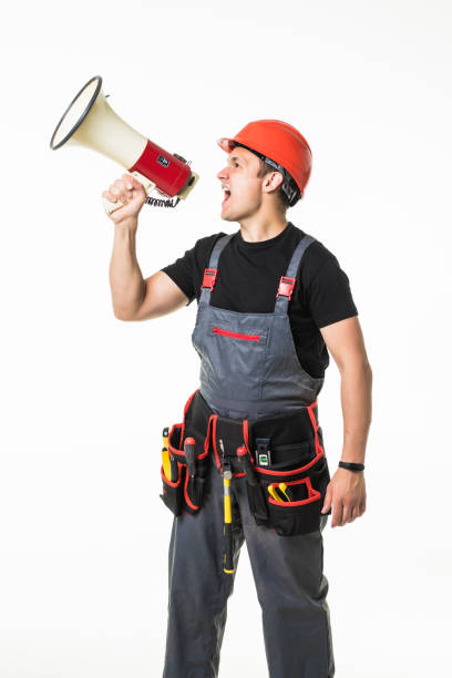 istock Full length of worker speaking into megaphone isolated over white background 1227340576