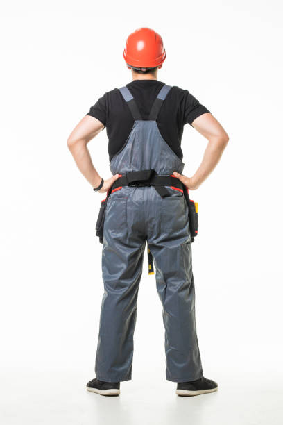 istock Rear view of thoughtful young worker looking up on white background 1227341106