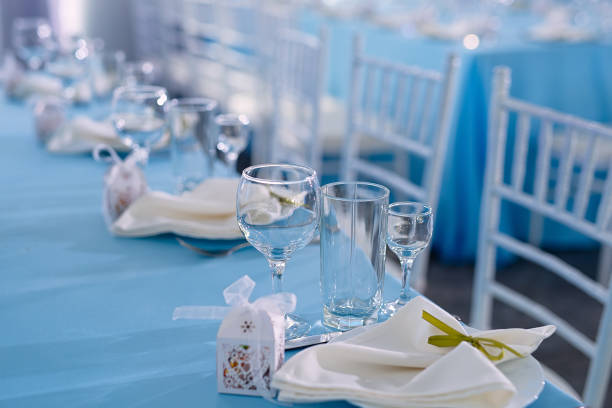 istock on the table with a blue tablecloth are dishes, napkins, a table for guests, a festive table, waiting for guests 1227344653