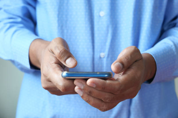 istock Close up of a man using mobile smart phone 1227346790