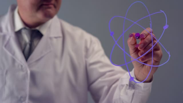 Scientist Drawing an Atomic Structure