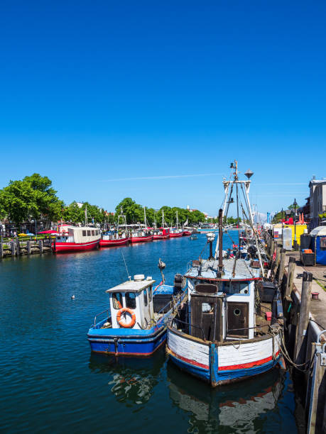 istock Fishing boats in spring time in Warnemuende, Germany 1227350309