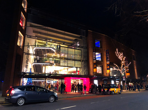 People leaving Sadler’s Wells Theatre after an evening performance of Matthew Bourne’s ‘Swan Lake’ at Christmas-time. Sadler’s Wells Theatre is famous for its productions of ballet and modern dance: the current building - opened in 1998 - is the sixth theatre on the site since 1683.