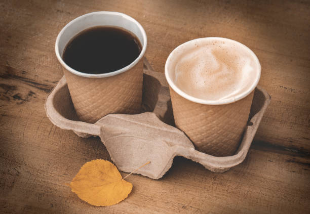 istock coffee cup to go at wooden background 1227354357