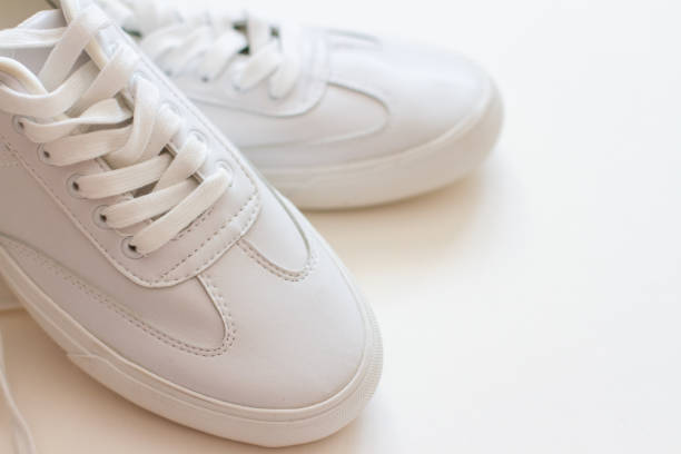 istock pair of white sneakers on white background 1227354414