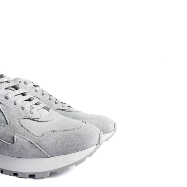 istock Gray sneakers isolated on white background. 1227355036