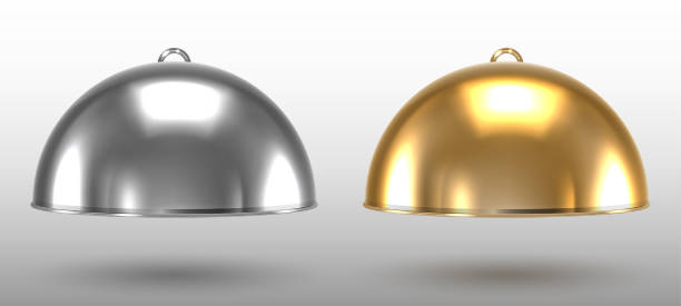 istock Silver and gold restaurant cloche on a white background 1227355322