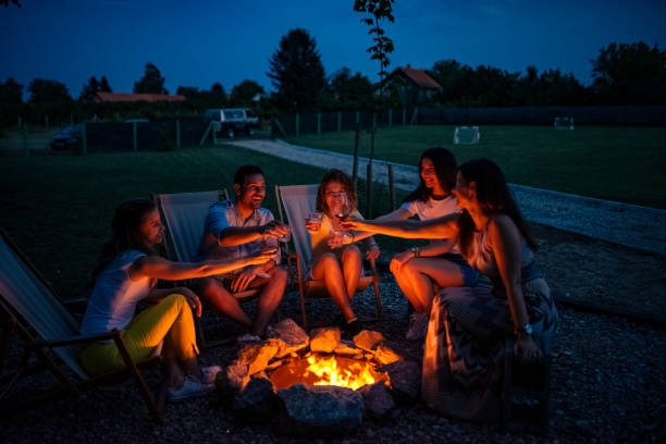 istock Friends toasting around a campfire. 1227355386
