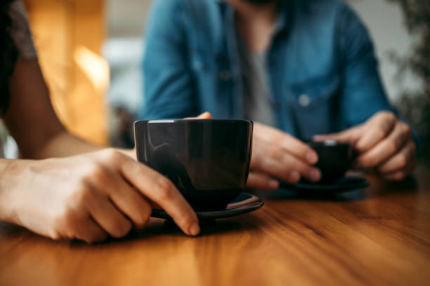 istock Drinking tea in a large black cup, close-up. 1227355418