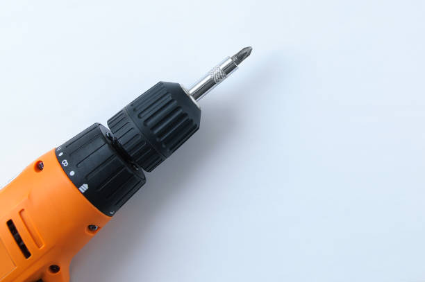 Close-up drill screwdriver on a white background. View from above.
