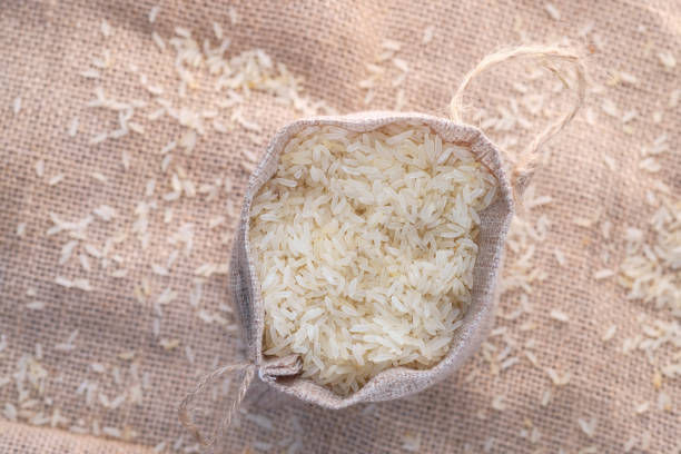 istock Rice in a bag on table cloth, Top view 1227359563
