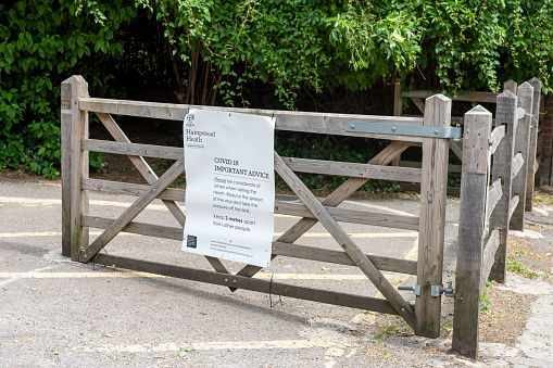 Car park closure notice on the gate into Hampstead Heath, North London, UK.