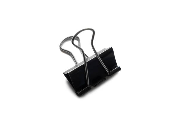 istock Black office  paperclip holding sheets  isolated on white background 1227359806