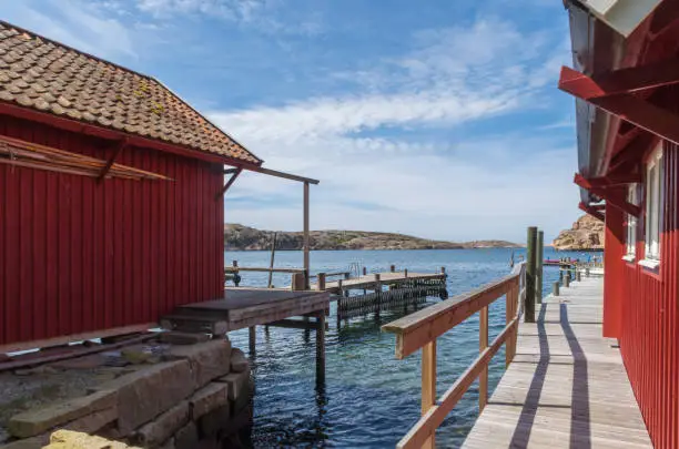 Photo of Red boathouses on the island Hamburgö; a small fishing port in the archipelago on the west coast of Bohuslän, Sweden