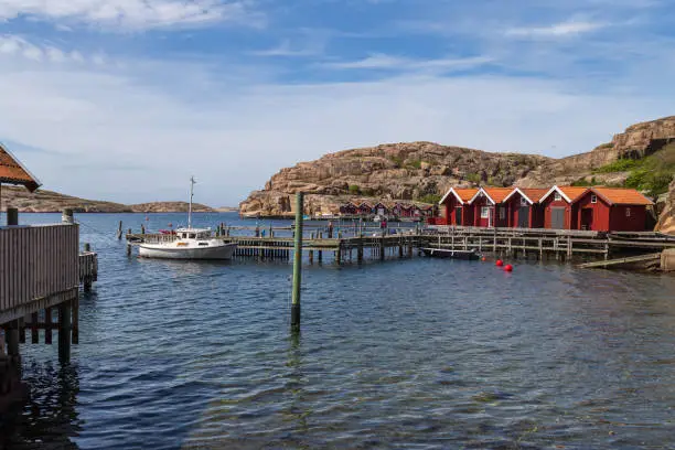 Photo of Red boathouses on the island Hamburgö; a small fishing port in the archipelago on the west coast of Bohuslän, Sweden