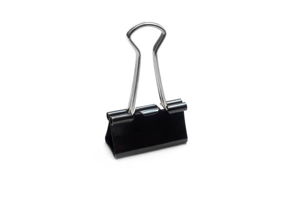 istock Black office  paperclip holding sheets  isolated on white background 1227360322