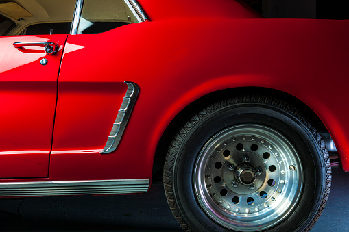 detail of a red vintage sports car
