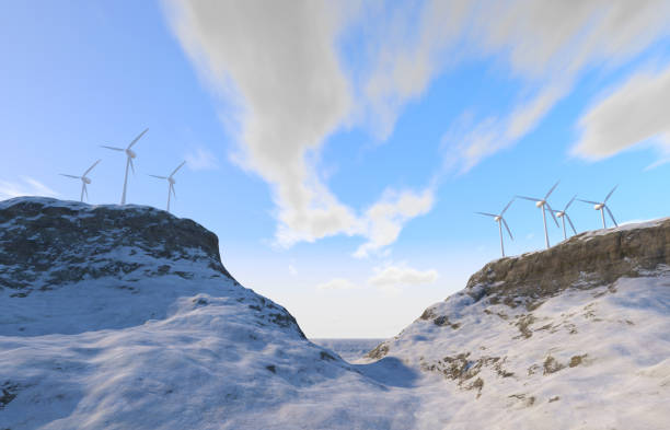 Wind farm against a beautiful blue sky with white clouds on snowy mountain