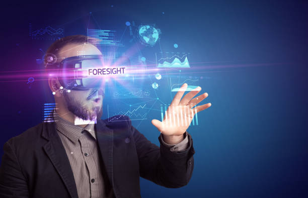 istock Businessman looking through Virtual Reality glasses 1227361173