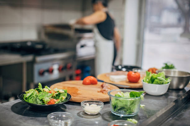 istock Woman chef working in commercial kitchen 1227361403