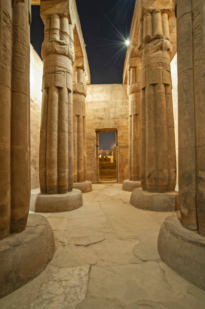 istock Hieroglyphic carvings on ancient egyptian temple columns at night 1227362027
