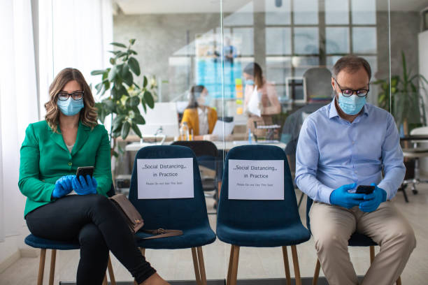 istock Social distancing in bank waiting room 1227362211