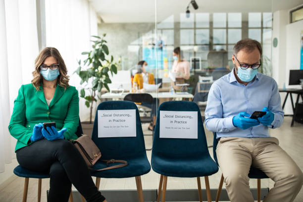 istock Clients keeps social distancing at bank waiting room 1227362376