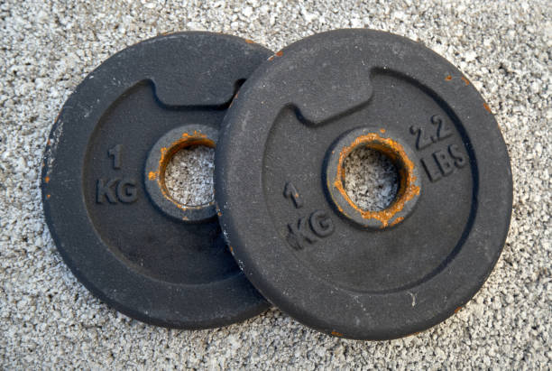 istock weight discs for rusty one-kg dumbbells 1227365781