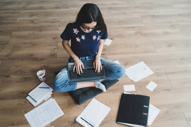 istock woman with glass home office working during covid 19 quarantine 1227368776