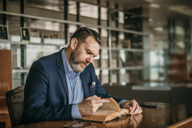 Reading Seriously 140+ Serious Book Reader Stock Photos, Pictures & Royalty-Free Images ...