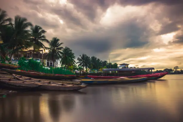 Shot from Bonassama using the long exposure technique at sunset, this picture depicts a colourful view of the banks of the Wouri river. The tropical vibe reflects the beauty of Cameroon
