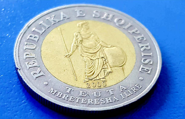 istock albanian lek coin on blue background 1227371882
