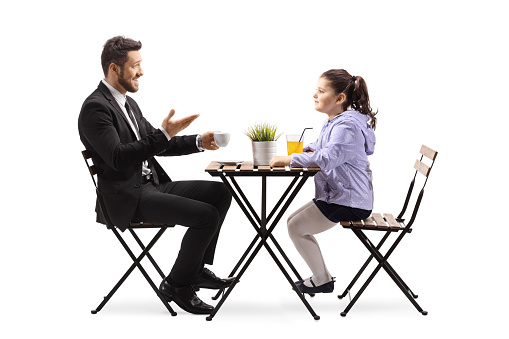 Father and daughter sitting at a cafe and talking isolated on white background