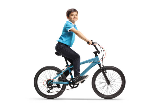 istock Happy boy riding a bicycle 1227375650