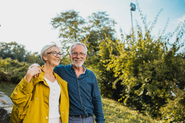 istock Seniors walking together and smiling 1227376524
