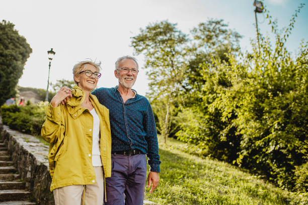 istock Seniors walking together and smiling 1227377353