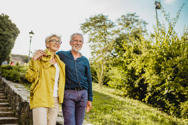 istock Seniors walking together and smiling 1227377957