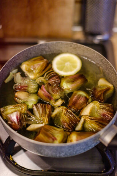 Italian boiled artichokes, healthy kitchen, diet concept.