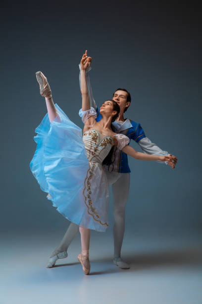 istock Young and graceful ballet dancers as Cinderella fairytail characters. 1227379749