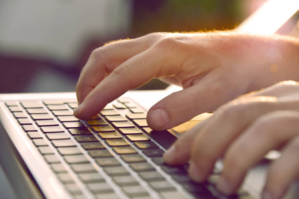 istock Closeup of man’s hands typing on laptop keyboard. 1227380770