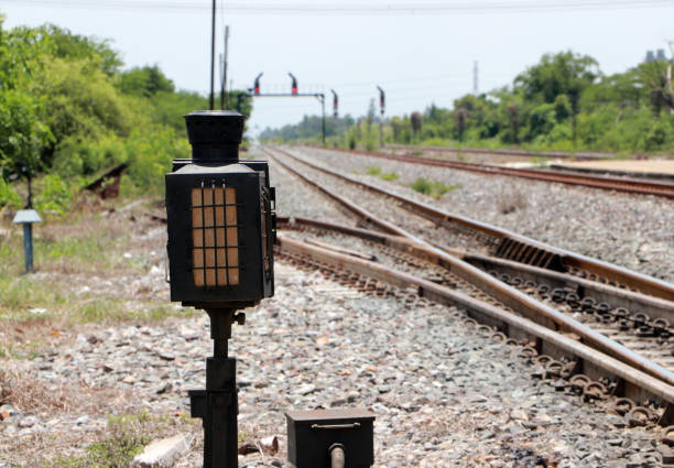 Signal lamp shunting railroad tracks. Installed beside the railway.