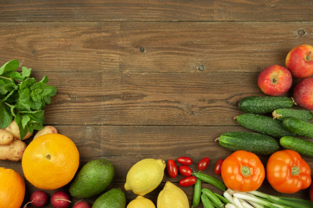 istock Flexitana diet concept.Composition with assorted fresh organic vegetables and fruits.Place for text.Cucumbers,tomatoes,radish, avocado, peas,potatoes,lemon,onions.Food on dark wooden background. 1227381380
